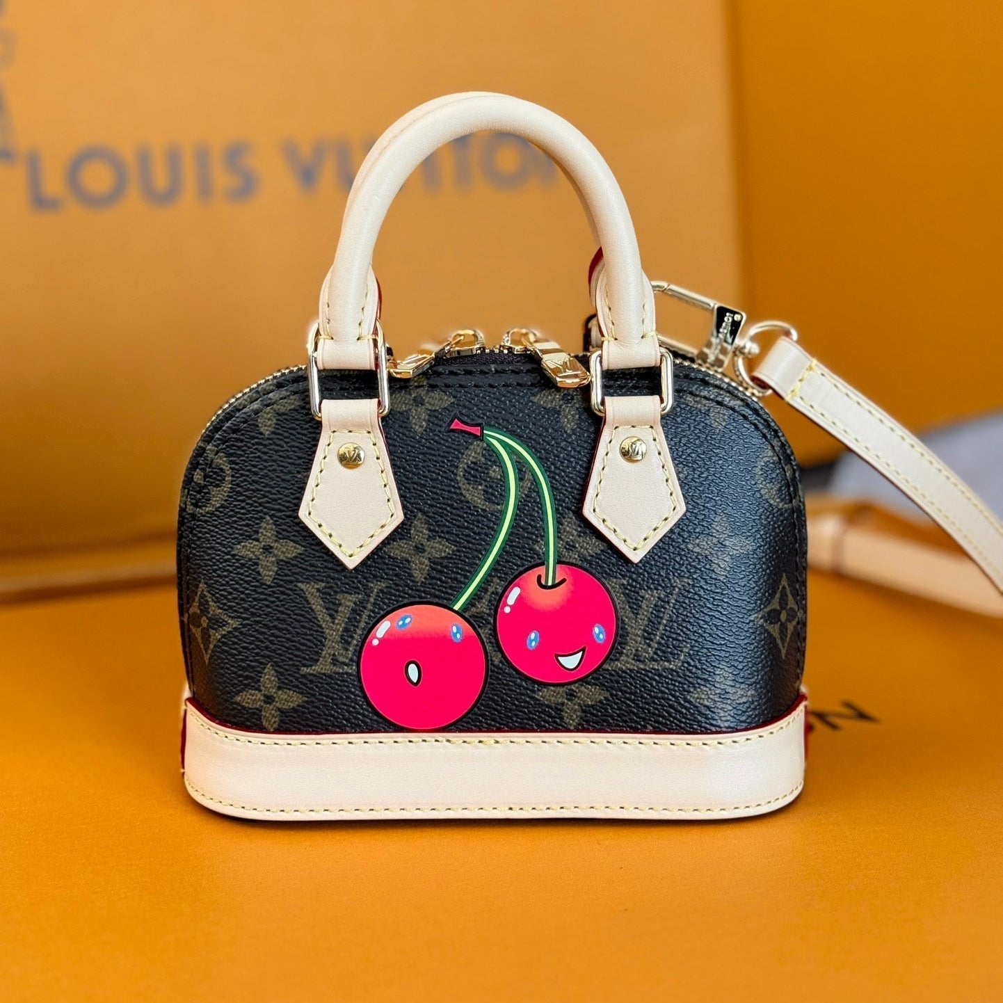 LOUIS VUITTON LV 25S NANO ALMA 18 IN DARK BROWN CANVAS MONOGRAM CHERRY PRINT GOLD HARDWARE